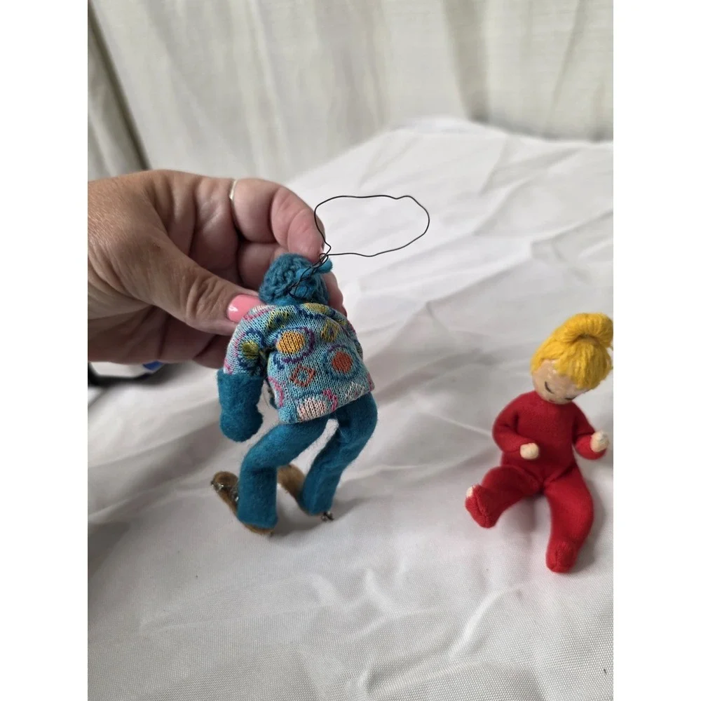Vintage German wire-frame poseable dolls with knitted clothing, circa 1960s